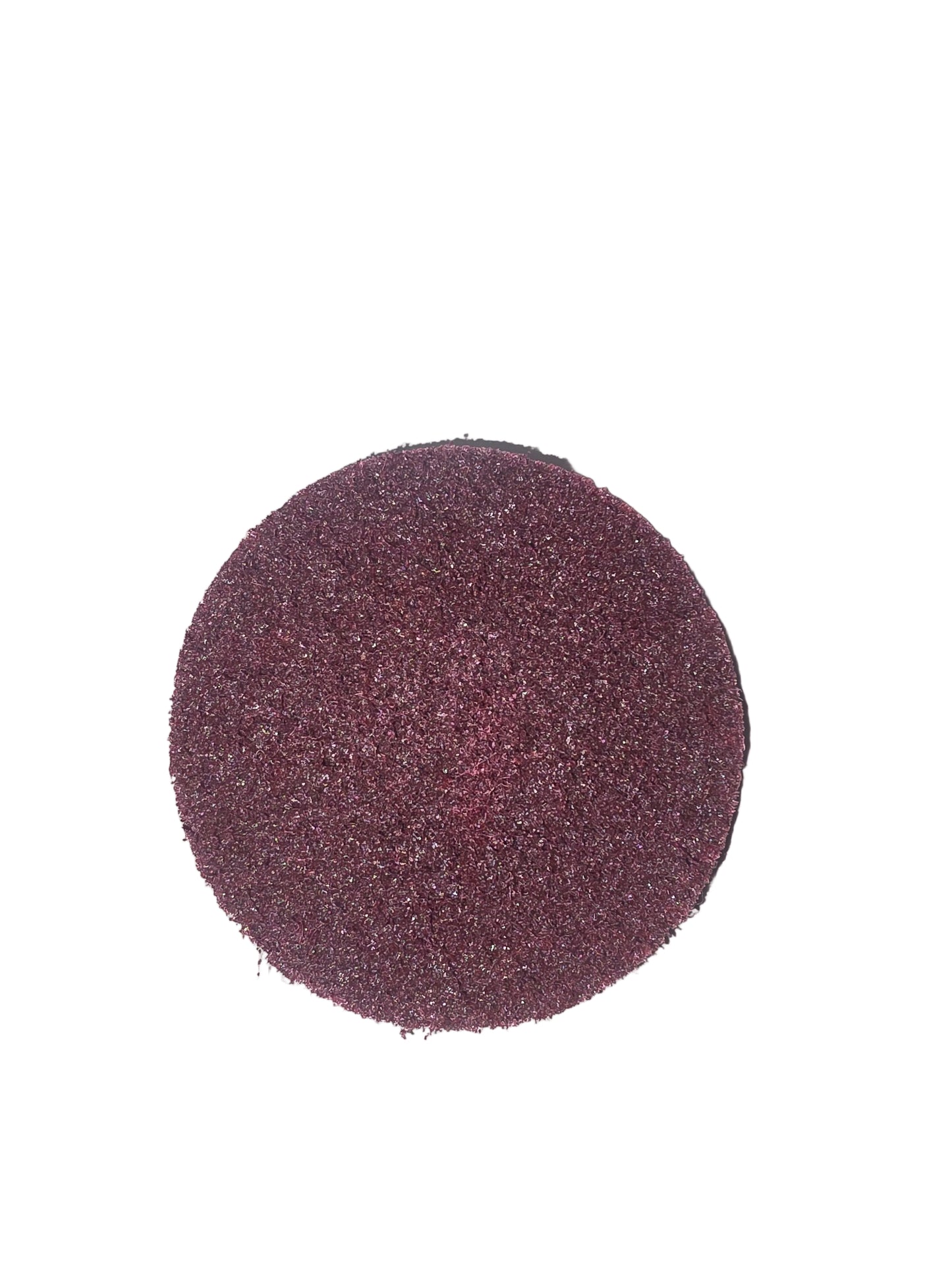 Round sandpaper disc on a white background